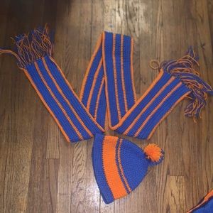 Handmade crocheted blue and orange Pom Pom hat and fringed scarf.